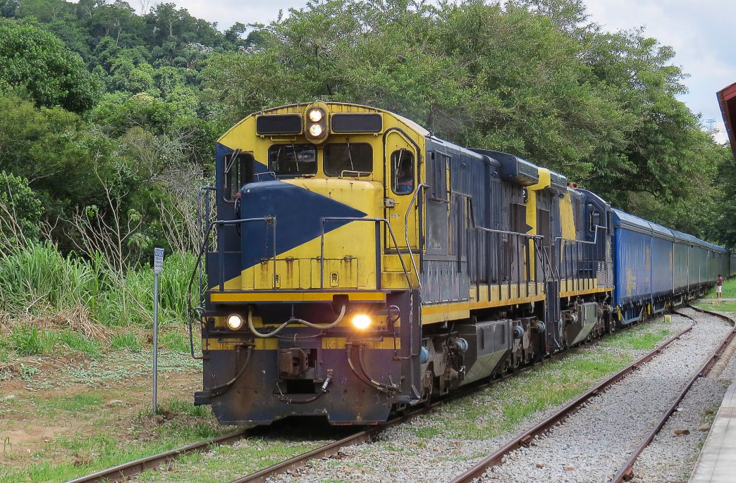 Railway, with freight train locomotive, in small deserted and quiet station, in the interior of Brazil, on sunny dayn locomotive, in small quiet and deserted station