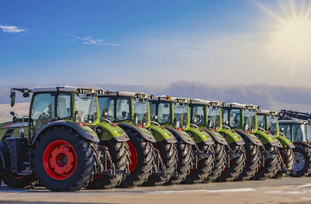Exhibition / new tractors lined up next to each other in a row