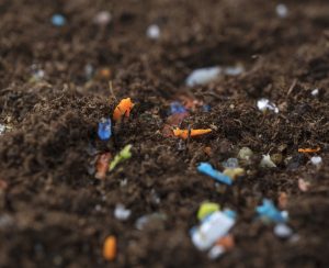 Microplastics inside the soil. Concept of global warming and climate change.