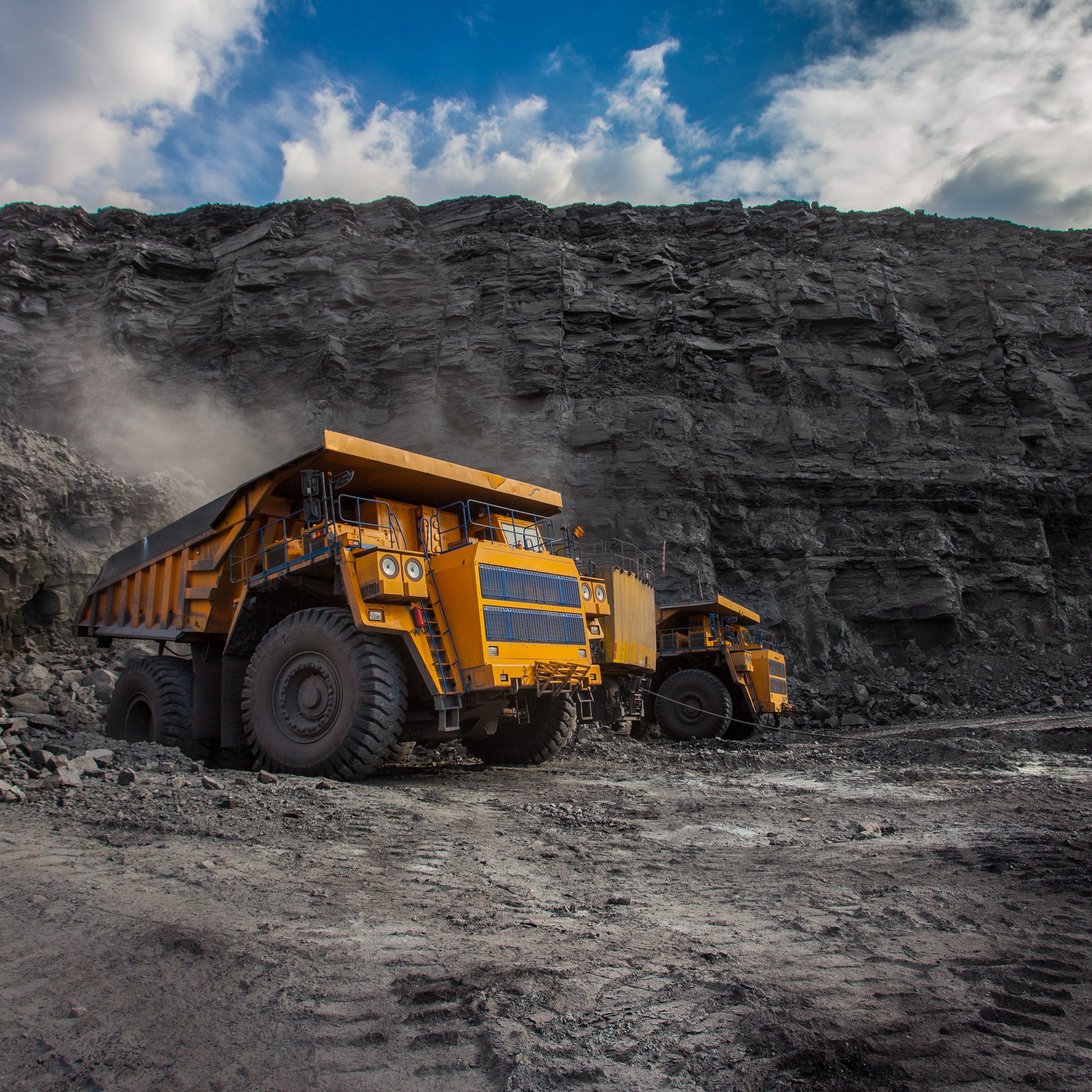 mining dump trucks loaded in a coal mine