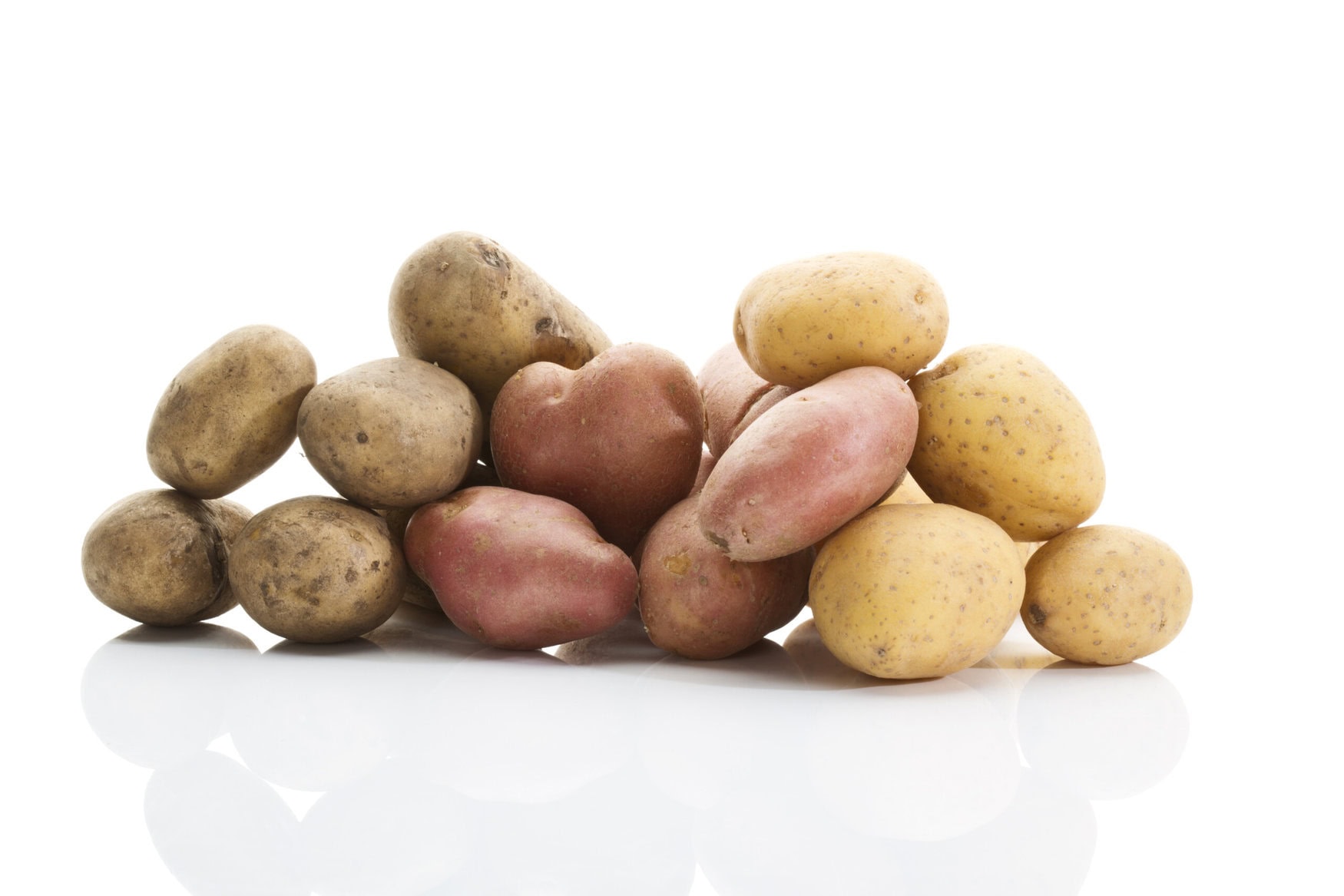 Different types of potatoes on white background